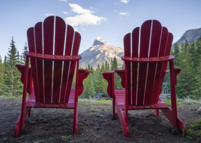 Adirondack deck chairs with view of Pilot Mountain at Johnston Canyon Lodge and Bungalows in Banff National Park