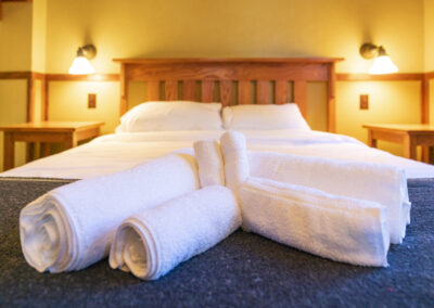Cabin bedroom at Johnston Canyon Lodge and Bungalows in Banff National Park