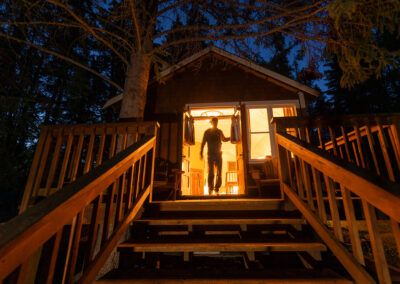 Silhouette of a guest in Cabin in Banff National Parks at night